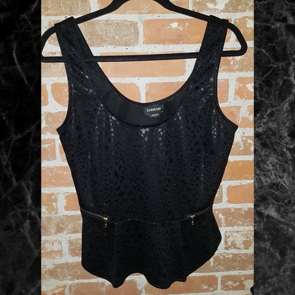 Bebe Animal Print Peplum Top. Medium.